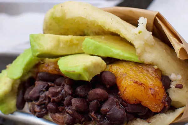 Arepa Grill signature dishes Pabellon ArepaReina Pepiada Arepa (Chicken Salad and Avocado)CachapasTequeños